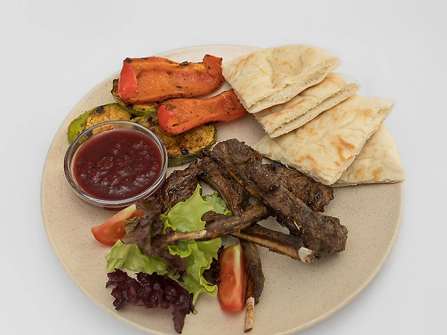 Lamb loin with grilled vegetables and tkemali sauce