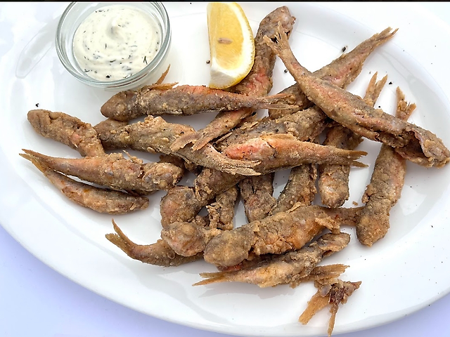 Barabula with sauce and lemon