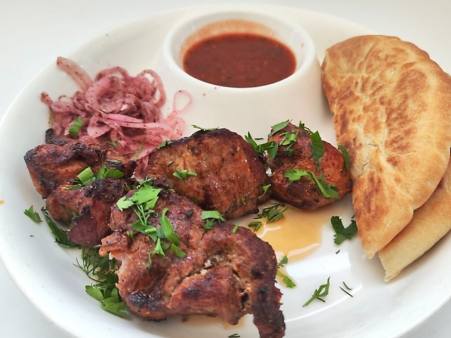 Pork kebab with pita and sauce