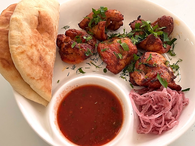 Chicken thigh kebab with pita and sauce