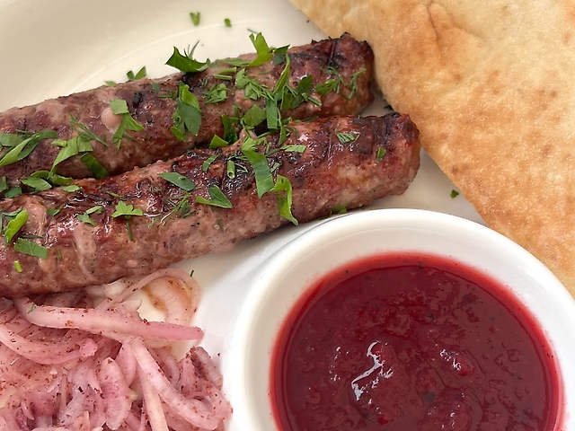 Lyula kebab from pork and veal with pita and sauce