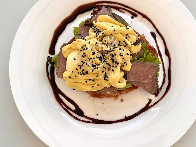 Eggs Benedict with salmon and avocado