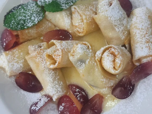 Sweet pancakes with vanilla sauce