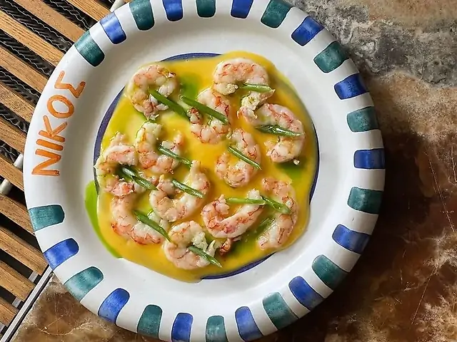 Лангустини  саганакі з соусом лимонакі