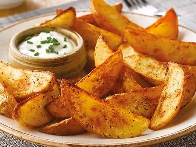 Картопля дольками с часником