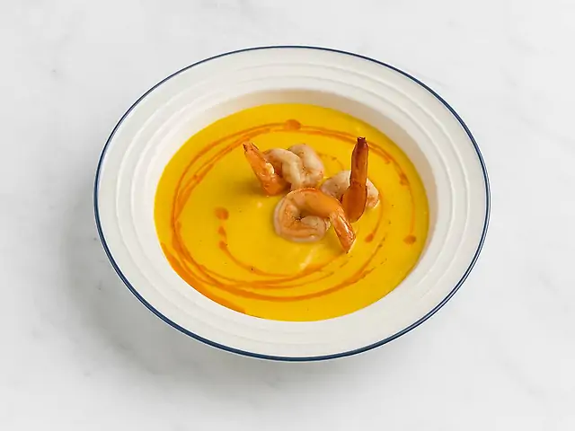 Pumpkin cream soup with tiger shrimp