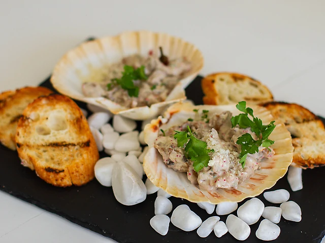 Рапани у вершковому соусі