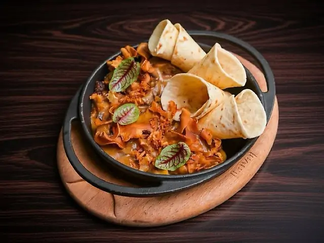 Рапани у вершково-устричному соусі з печерицями